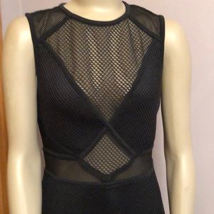 Black cocktail dress with net inserts